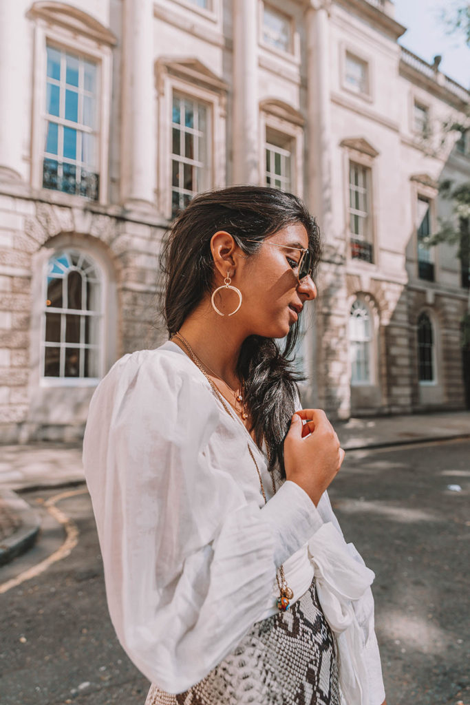 Fashion blogger Shloka Narang of The Silk Sneaker shares the summer blouse you need to create a cute summer outfit featuring ba&sh, Celine and Ray-Ban