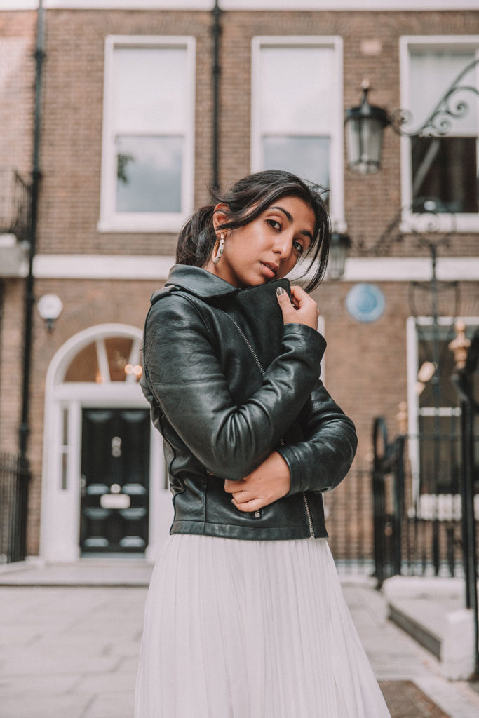 Luxury fashion blogger Shloka Narang of The Silk Sneaker shares how to style a summer pleated maxi skirt for autumn featuring Maje and Isabel Marant in a summer to fall transitional outfit