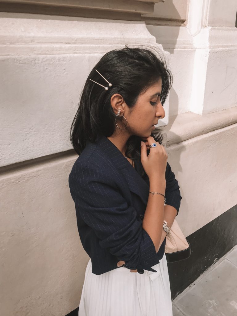 Luxury fashion blogger shloka narang of The Silk Sneaker shares her outfit details for her autumn look for London Fashion Week street style