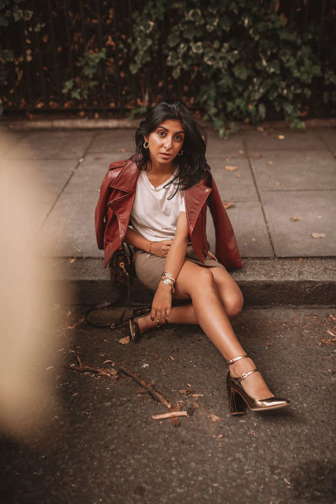 Luxury fashion blogger Shloka Narang of The Silk Sneaker shares how to wear a slogan tee in the autumn featuring Saint Laurent, & Other Stories and Louis Vuitton