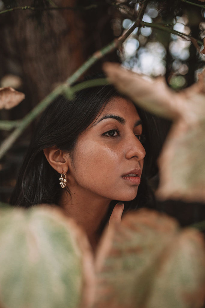 Luxury fashion blogger Shloka Narang of The Silk Sneaker shares how to wear a slogan tee in the autumn featuring Saint Laurent, & Other Stories and Louis Vuitton