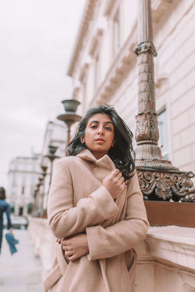 Luxury fashion blogger Shloka Narang of The Silk Sneaker shares the best winter coats on the high street and designer retailers featuring & Other Stories and Stuart Weitzman