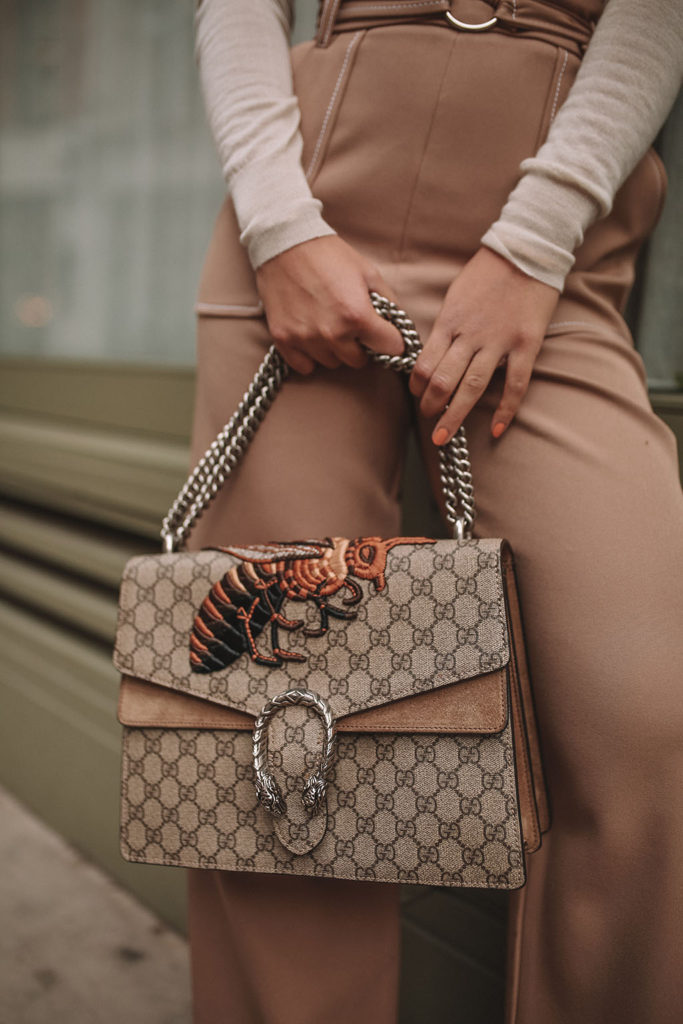 Luxury fashion blogger Shloka Narang of The Silk Sneaker shares what to wear to work in winter with a quick and cute outfit formula for the colder months with Topshop, Joseph and Gucci