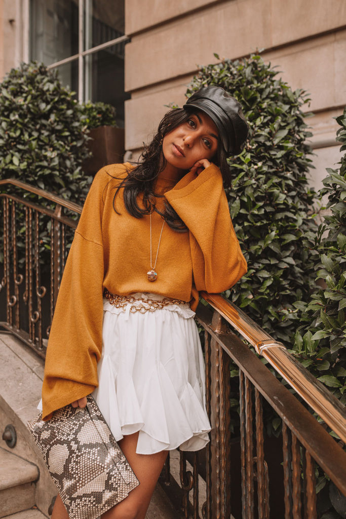 Luxury fashion blogger Shloka Narang of The Silk Sneaker shares her styling tips for a cute autumn outfit idea with cozy sweaters featuring the colour of the season; mustard yellow, in Theory, Isabel Marant and Loewe
