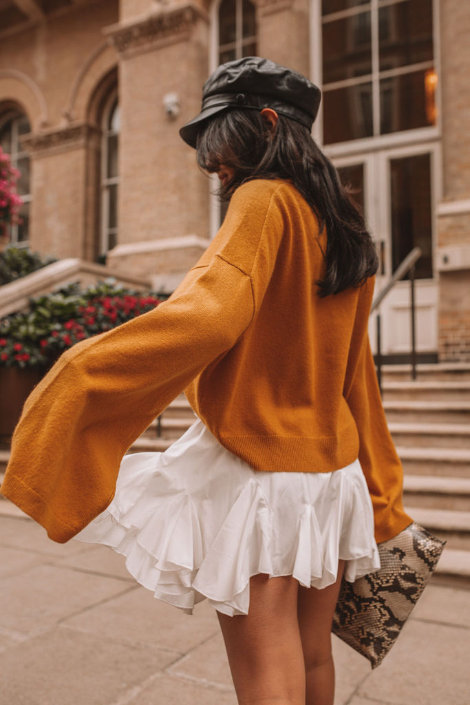 Luxury fashion blogger Shloka Narang of The Silk Sneaker shares her styling tips for a cute autumn outfit idea with cozy sweaters featuring the colour of the season; mustard yellow, in Theory, Isabel Marant and Loewe