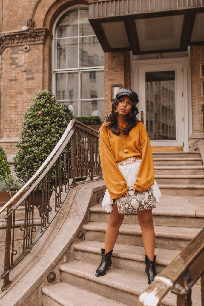 Luxury fashion blogger Shloka Narang of The Silk Sneaker shares her styling tips for a cute autumn outfit idea with cozy sweaters featuring the colour of the season; mustard yellow, in Theory, Isabel Marant and Loewe