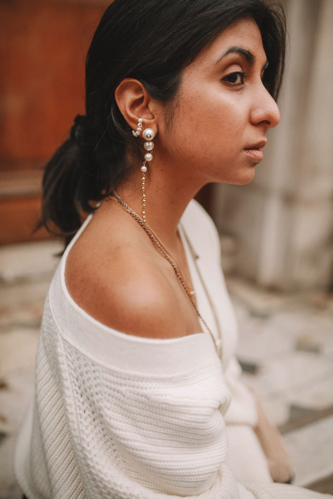 Luxury fashion blogger Shoka Narang of The Silk Sneaker shares how to style an oversized knit cardigan for a cute winter outfit with & Other Stories, Chanel backpack and Gucci Sneakers