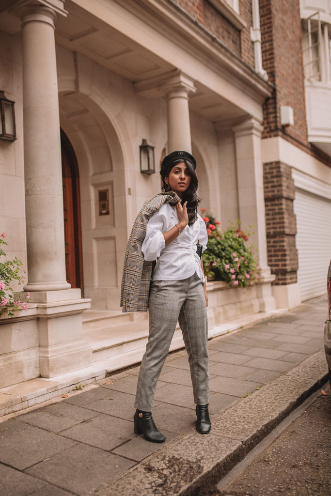 Luxury fashion blogger Shloka Narang of The Silk Sneaker shows how to style a plaid blazer and plaid pants for a casual chic fall outfit