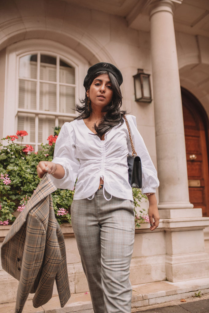 Luxury fashion blogger Shloka Narang of The Silk Sneaker shows how to style a plaid blazer and plaid pants for a casual chic fall outfit