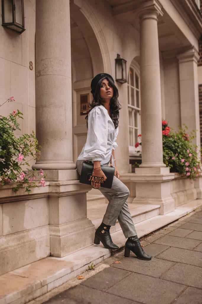 Luxury fashion blogger Shloka Narang of The Silk Sneaker shows how to style a plaid blazer and plaid pants for a casual chic autumn outfit