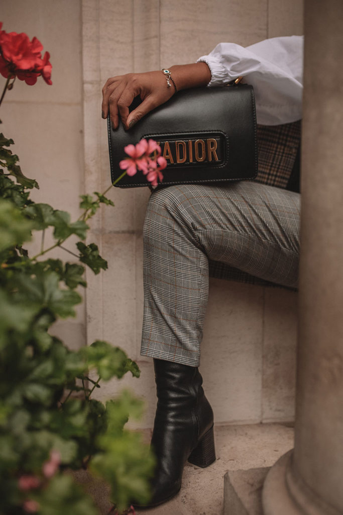 Luxury fashion blogger Shloka Narang of The Silk Sneaker shows how to style a plaid blazer and plaid pants for a casual chic fall outfit