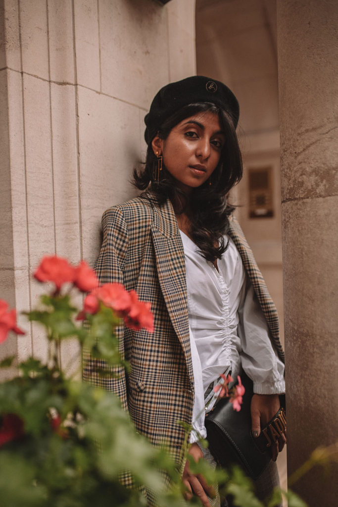 Luxury fashion blogger Shloka Narang of The Silk Sneaker shows how to style a plaid blazer and plaid pants for a casual chic fall outfit