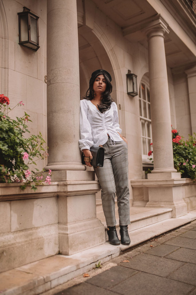 Luxury fashion blogger Shloka Narang of The Silk Sneaker shows how to style a plaid blazer and plaid pants for a casual chic autumn outfit