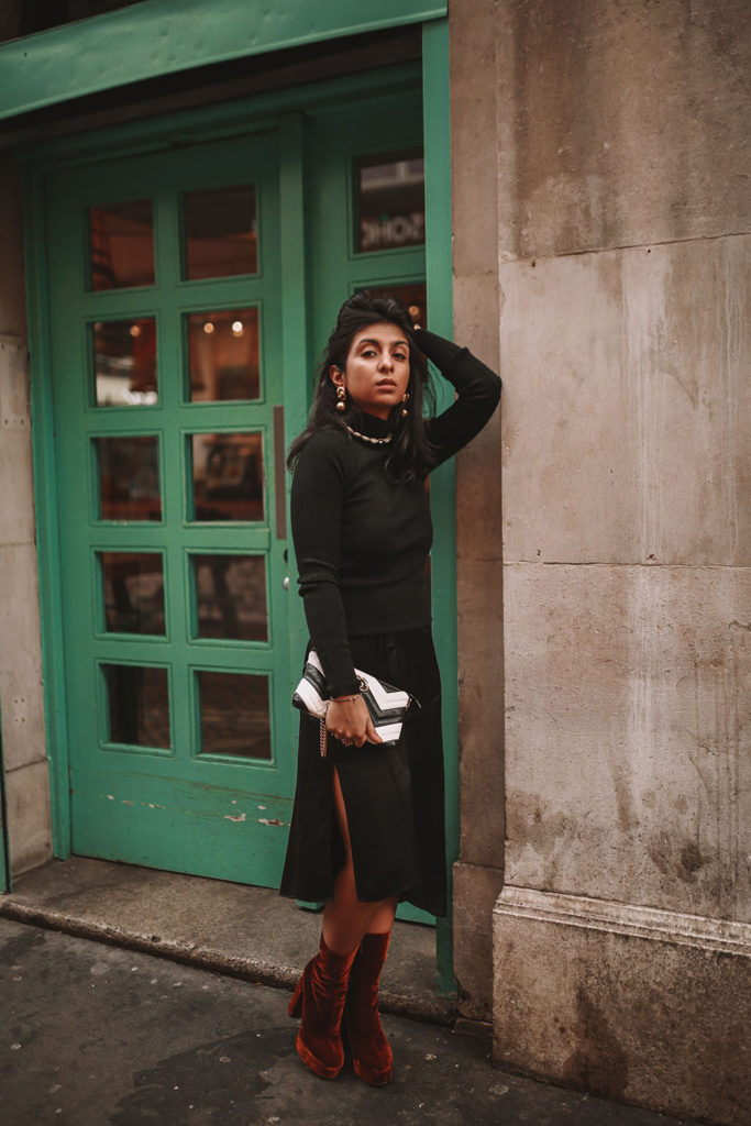 Luxury fashion blogger Shloka Narang shares how to style a silk slip midi skirt for the winter featuring & other stories, Miu Miu and Gucci