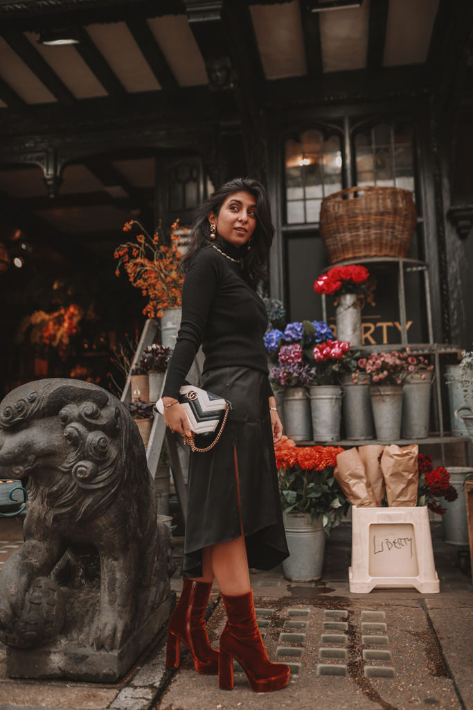 Luxury fashion blogger Shloka Narang shares how to style a silk slip midi skirt for the winter featuring & other stories, Miu Miu and Gucci