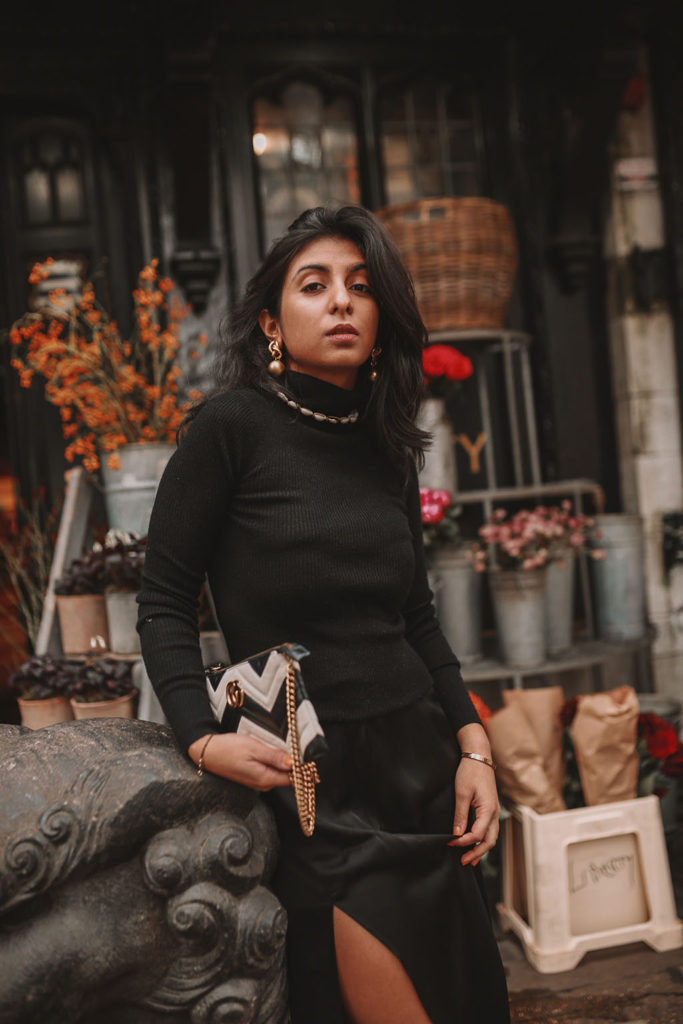 Luxury fashion blogger Shloka Narang shares how to style a silk slip midi skirt for the winter featuring & other stories, Miu Miu and Gucci