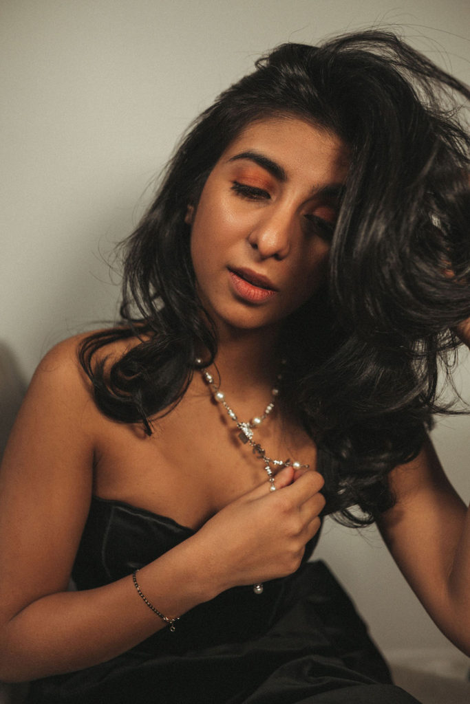 Luxury fashion and beauty blogger Shloka Narang of The Silk Sneaker shares three unique holiday party looks inspired by Chanel holiday makeup using Chanel Christmas makeup collection