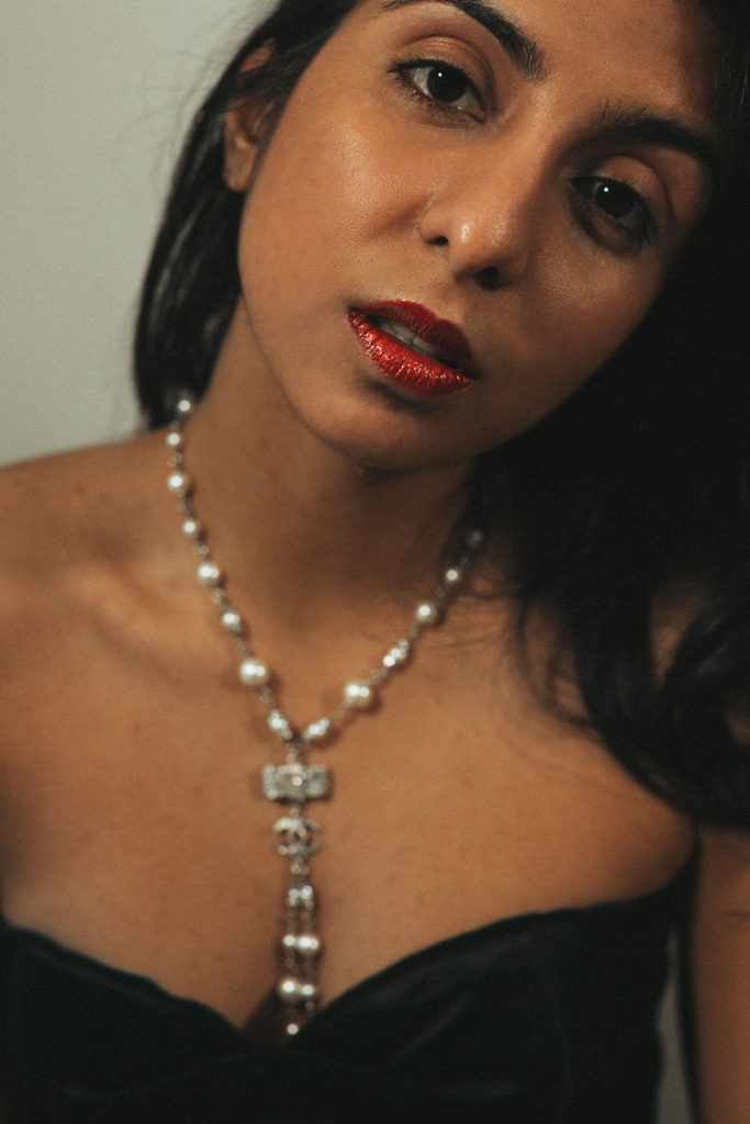 Luxury fashion and beauty blogger Shloka Narang of The Silk Sneaker shares three unique holiday party looks inspired by Chanel holiday makeup using Chanel Christmas makeup collection
