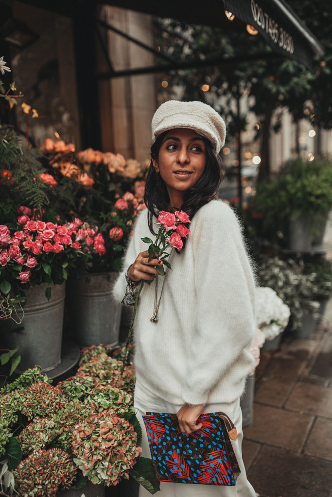Luxury fashion blogger Shloka Narang of The Silk Sneaker shares how to wear white in winter with an all white outfit featuring Ba&sh, Louis Vuitton and Topshop