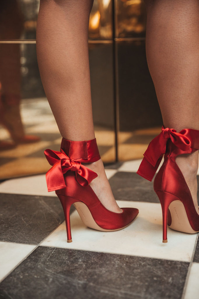 Luxury fashion blogger Shloka Narang of The Silk Sneaker shares a holiday party outfit idea featuring a sequins skirt from Topshop and Gianvitto Rossi heels