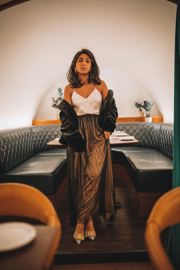Luxury fashion blogger Shloka Narang of The Silk Sneaker shares her three top tips for creating a chic holiday party outfit to stand out from the crowd