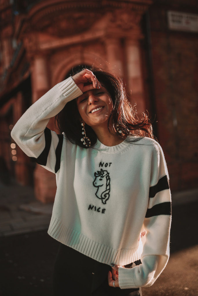 Luxury fashion blogger Shloka Narang of The Silk Sneaker shares her casual winter outfit ideas for a cute outfit with her style commandments featuring Miu Miu, black combat boots and a Zara Skirt
