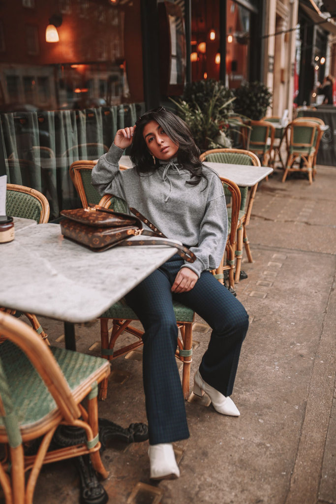 Luxury fashion blogger Shloka Narang of The Silk Sneaker shares what to wear to work in winter for stylish office outfits featuring Sandro and Louis Vuitton