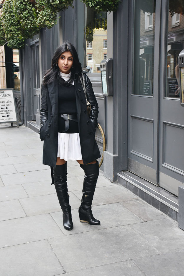 Fashion blogger Shloka Narang of The Silk Sneaker shows how to layer a dress this winter in an ASOS dress and Whistles Sweater