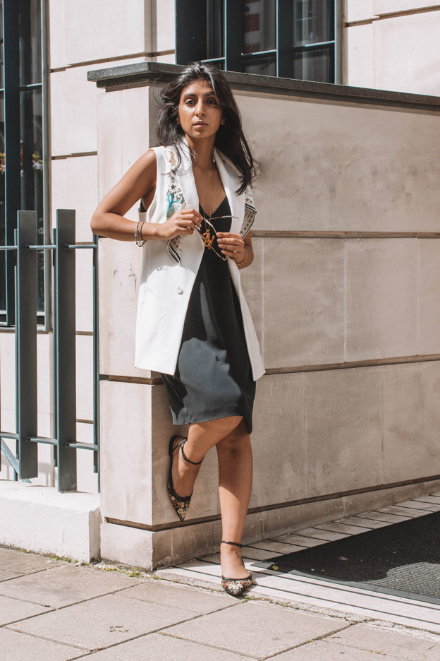 Fashion blogger Shloka Narang of The Silk Sneaker showcases how to style a slip dress for autumn