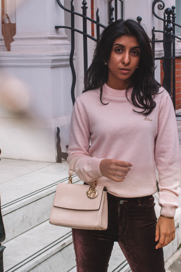 Fashion blogger Shloka Narang of The Silk Sneaker showcases how to style velvet pants in a winter outfit with Paige and Dior