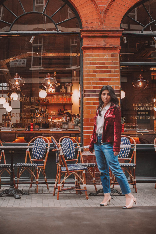 Fashion blogger Shloka Narang of The Silk Sneaker shares a polka dots spring outfit idea for a casual look featuring Topshop Jeans, Fabled polka dots shirt and Chanel shoes.