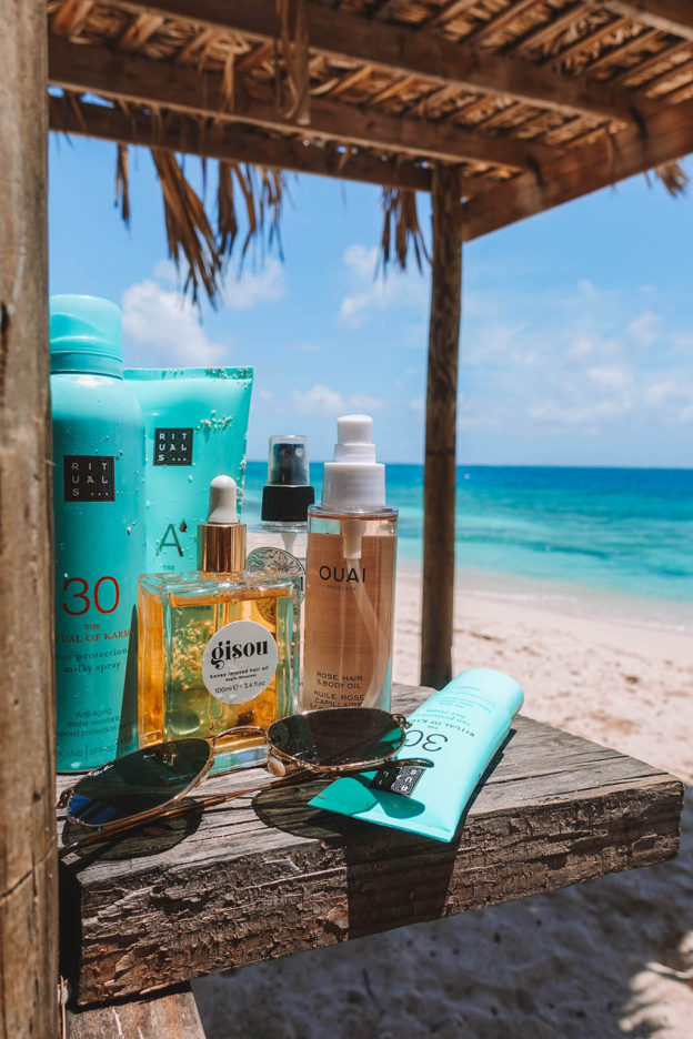 Fashion and beauty blogger Shloka Narang of The Silk Sneaker shares her best summer beauty products suited for the heat and days by the beach including Gisou and The Ouai.