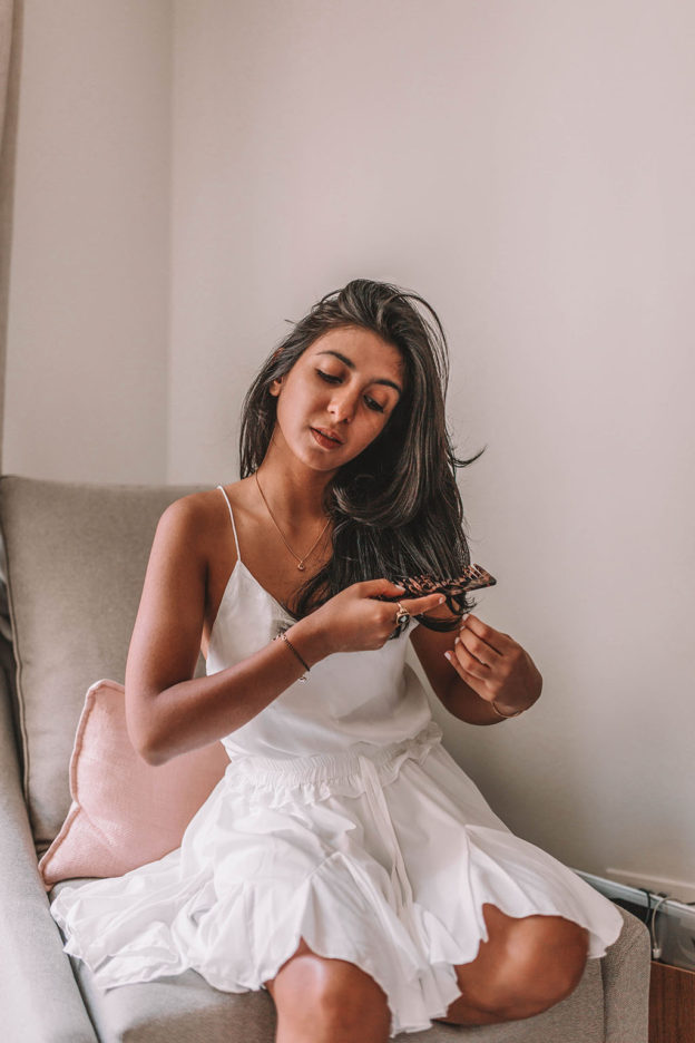 Beauty blogger Shloka Narang of The Silk Sneaker shares the best hair products for 2018 for thicker, stronger hair featuring Gisou, Aesop and The Ouai
