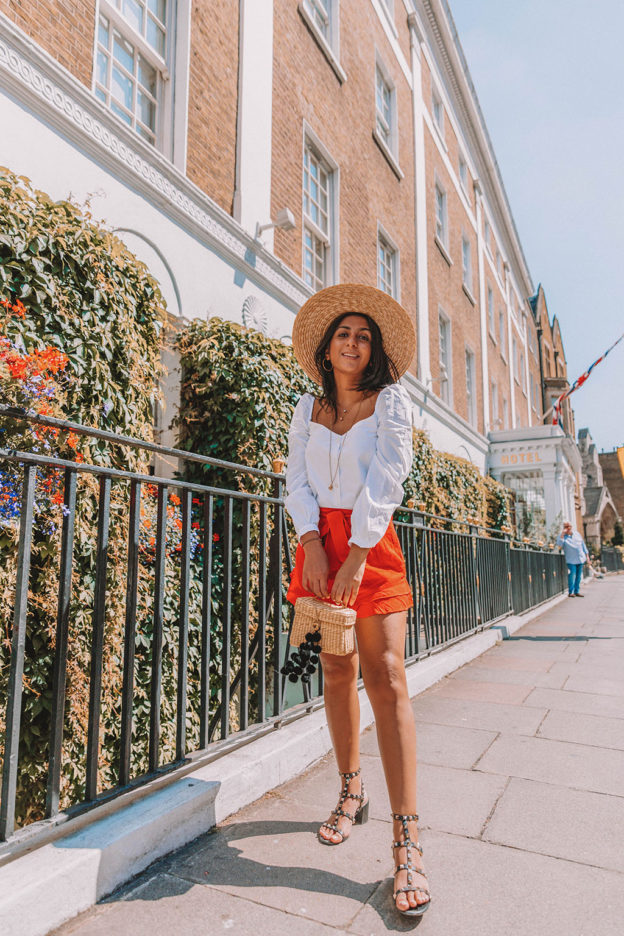 Fashion blogger Shloka Narang of The Silk Sneaker shares how to style a summer 2018 top in a sweetheart neckline for a cute summer outfit featuring Zara, Valentino and Chriselle x JOA