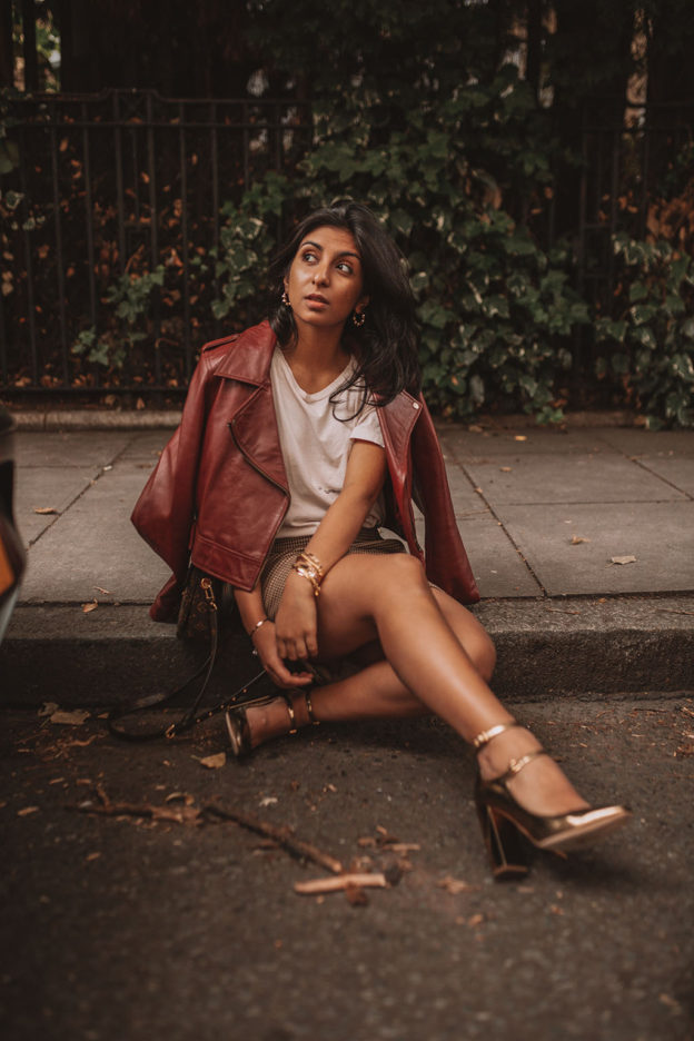 Luxury fashion blogger Shloka Narang of The Silk Sneaker shares how to wear a slogan tee in the autumn featuring Saint Laurent, & Other Stories and Louis Vuitton