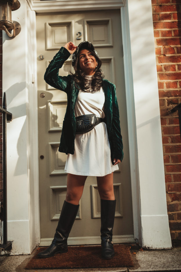Luxury fashion blogger Shloka Narang of The Silk Sneaker shares how to wear a belt bag with a Prada belt bag, ASOS dress and velvet blazer for a winter outfit