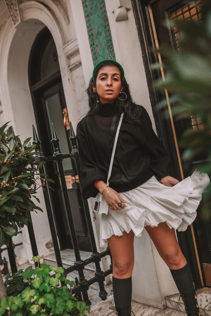 Luxury fashion blogger Shloka Narang of The Silk Sneaker showcases a spring outfit with her tips on how to get ready faster in the morning with Givenchy, Storets and Prada Headband