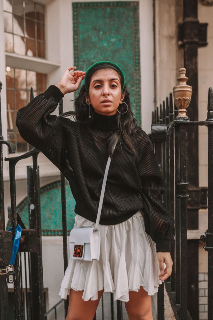Luxury fashion blogger Shloka Narang of The Silk Sneaker showcases a spring outfit with her tips on how to get ready faster in the morning with Givenchy, Storets and Prada Headband
