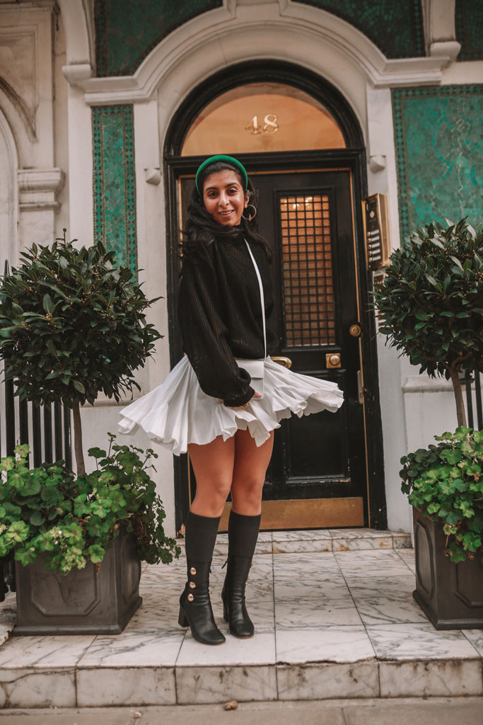 Luxury fashion blogger Shloka Narang of The Silk Sneaker showcases a spring outfit with her tips on how to get ready faster in the morning with Givenchy, Storets and Prada Headband
