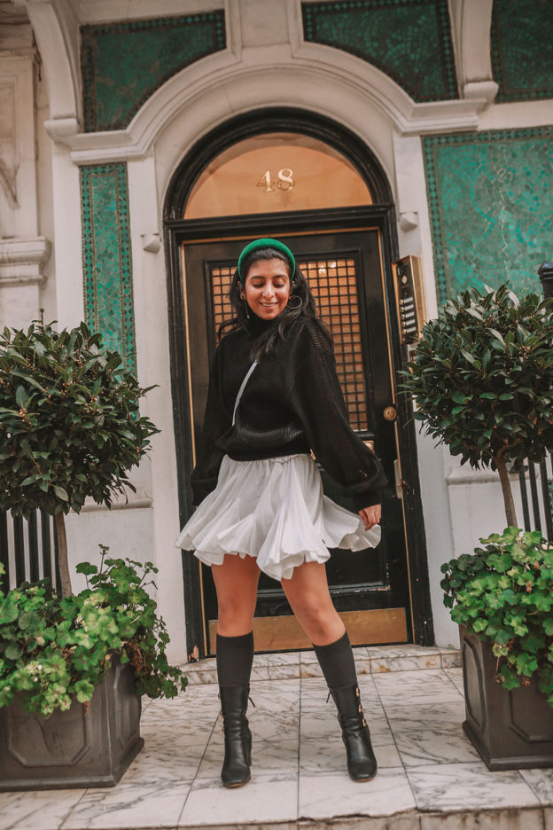 Luxury fashion blogger Shloka Narang of The Silk Sneaker showcases a spring outfit with her tips on how to get ready faster in the morning with Givenchy, Storets and Prada Headband