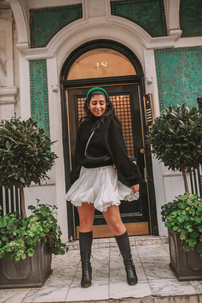 Luxury fashion blogger Shloka Narang of The Silk Sneaker showcases a spring outfit with her tips on how to get ready faster in the morning with Givenchy, Storets and Prada Headband
