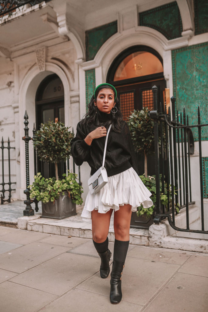 Luxury fashion blogger Shloka Narang of The Silk Sneaker showcases a spring outfit with her tips on how to get ready faster in the morning with Givenchy, Storets and Prada Headband