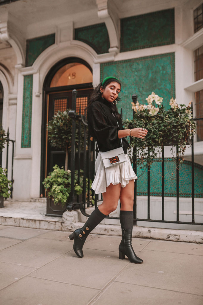 Luxury fashion blogger Shloka Narang of The Silk Sneaker showcases a spring outfit with her tips on how to get ready faster in the morning with Givenchy, Storets and Prada Headband