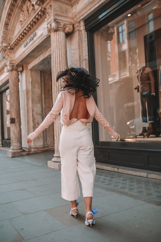 Luxury fashion blogger Shloka Narang of The Silk Sneaker shares her tips on how to dress Parisian in a cute spring outfit featuring Tibi and Prada