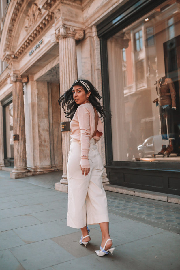 Luxury fashion blogger Shloka Narang of The Silk Sneaker shares her tips on how to dress Parisian in a cute spring outfit featuring Tibi and Prada