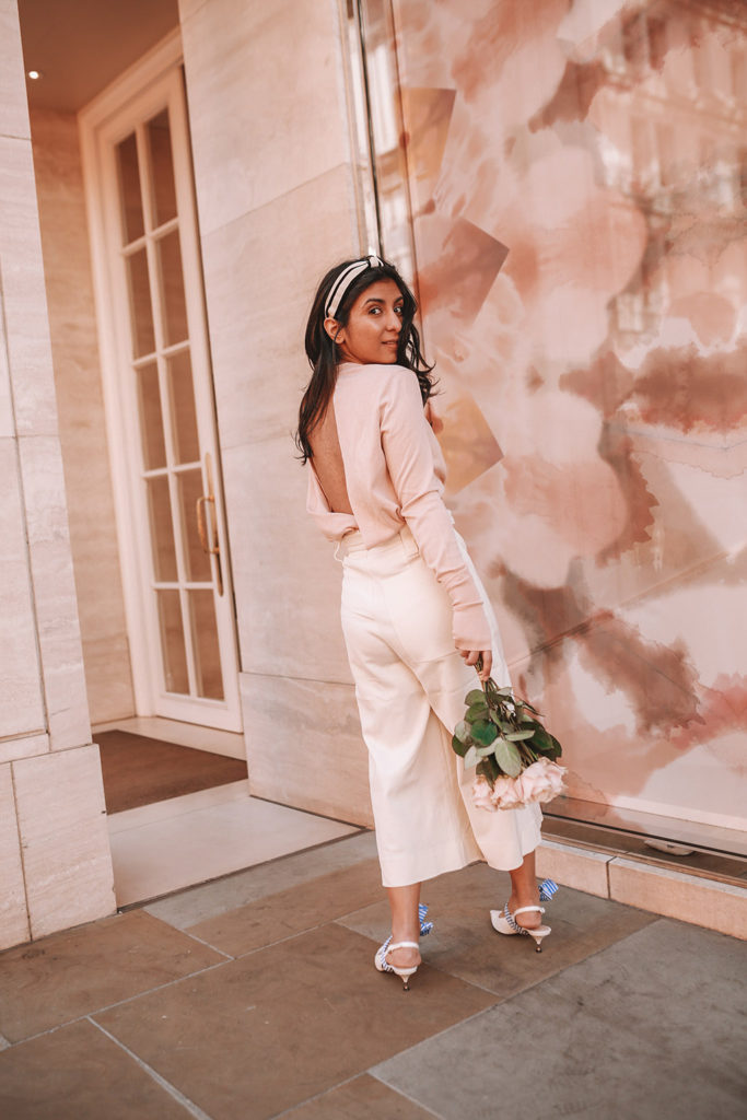 Luxury fashion blogger Shloka Narang of The Silk Sneaker shares her tips on how to dress Parisian in a cute spring outfit featuring Tibi and Prada