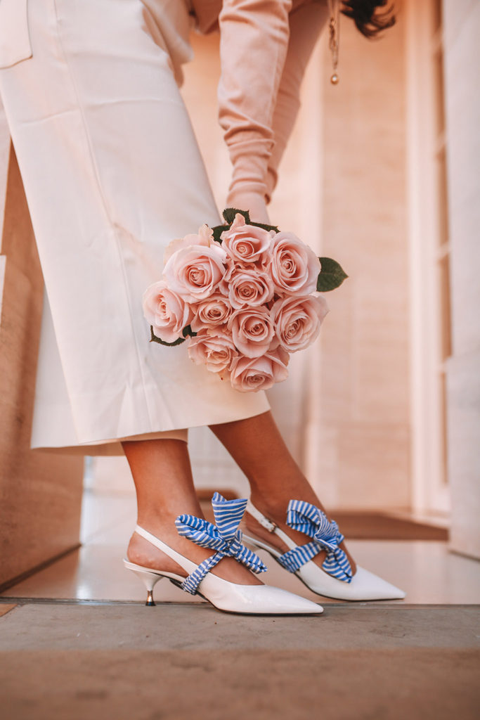 Luxury fashion blogger Shloka Narang of The Silk Sneaker shares her tips on how to dress Parisian in a cute spring outfit featuring Tibi and Prada