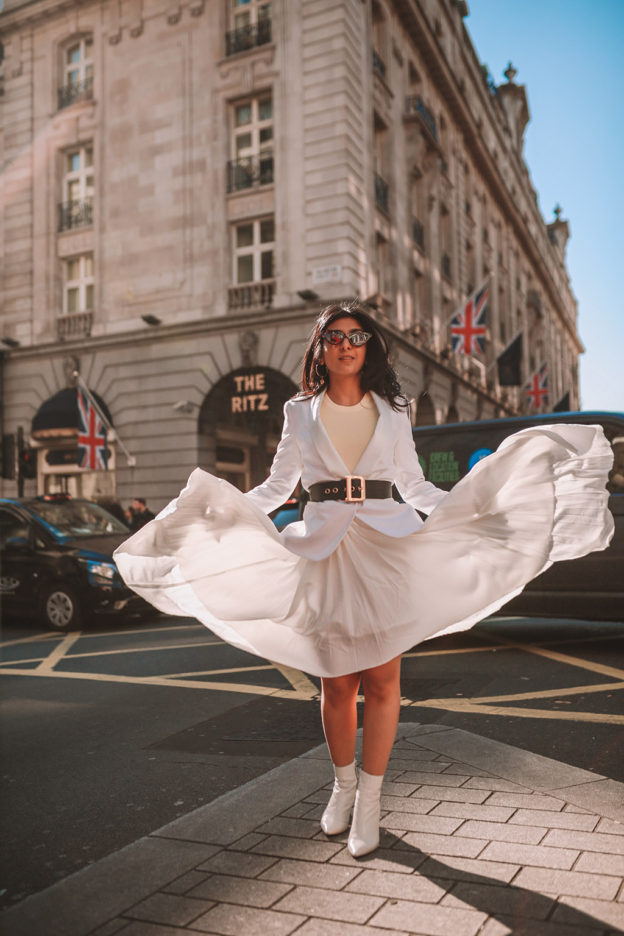 Luxury fashion blogger Shloka Narang of The Silk Sneaker shares her take on how to wear an elegant all white outfit for a chic spring look featuring Dior