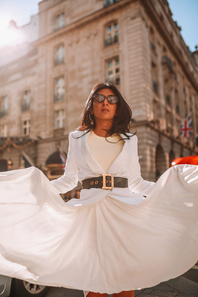 Luxury fashion blogger Shloka Narang of The Silk Sneaker shares her take on how to wear an elegant all white outfit for a chic spring look featuring Dior