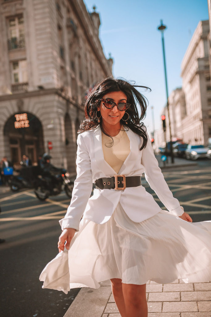 Luxury fashion blogger Shloka Narang of The Silk Sneaker shares her take on how to wear an elegant all white outfit for a chic spring look featuring Dior